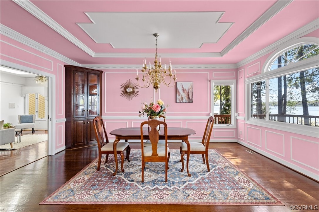 14324 Regatta Pointe Road Midlothian, VA 23112 - Photo 16 of 50 a dining room with furniture a rug and wooden floor