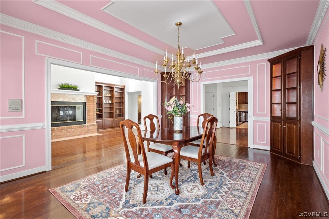 14324 Regatta Pointe Road Midlothian, VA 23112 - Photo 17 of 50 a dining room with furniture a chandelier and wooden floor