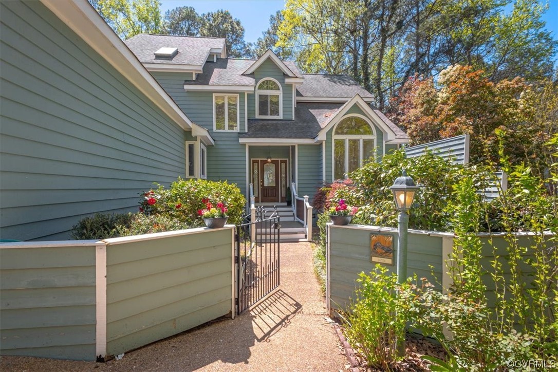 14324 Regatta Pointe Road Midlothian, VA 23112 - Photo 2 of 50 a front view of a house with a garden