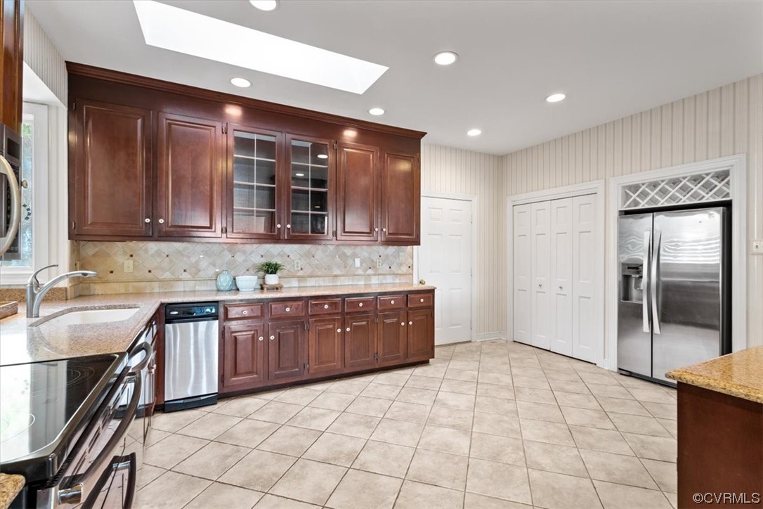 14324 Regatta Pointe Road Midlothian, VA 23112 - Photo 23 of 50 a large kitchen with stainless steel appliances granite countertop a sink and cabinets