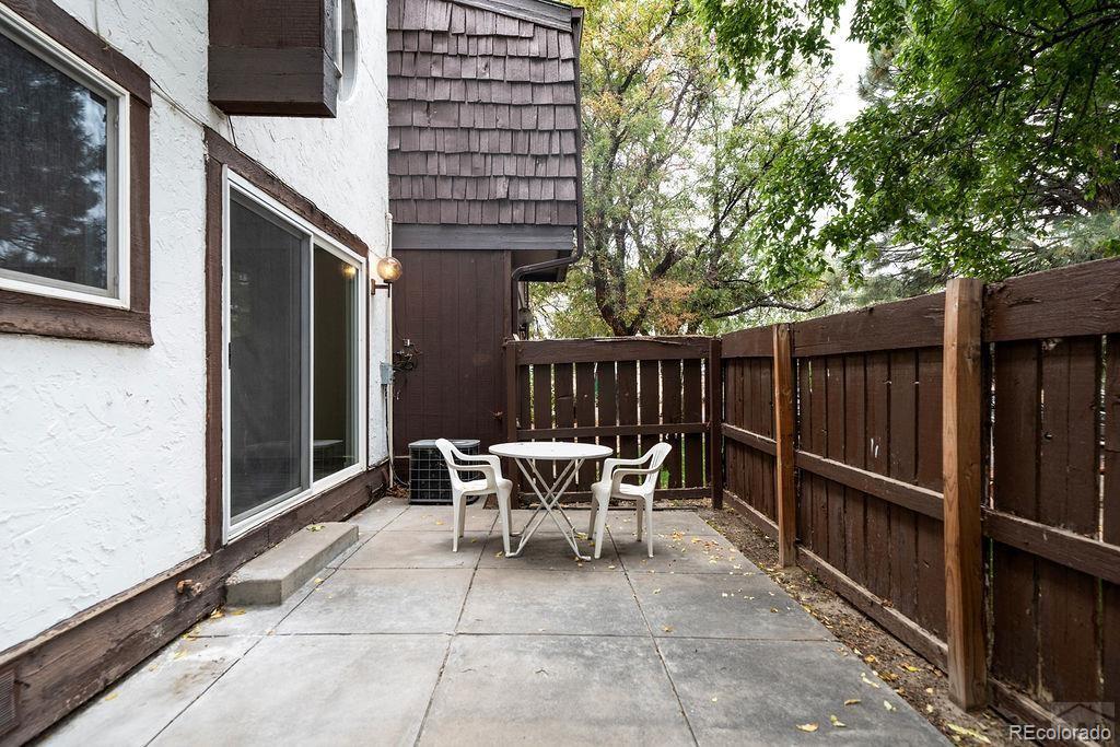112 Scotland Road, Unit F Pueblo, CO 81001 - Photo 14 of 39 a patio with table and chairs