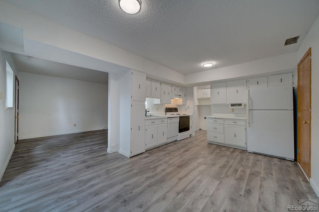 112 Scotland Road, Unit F Pueblo, CO 81001 - Photo 20 of 39 a view of kitchen with wooden floor