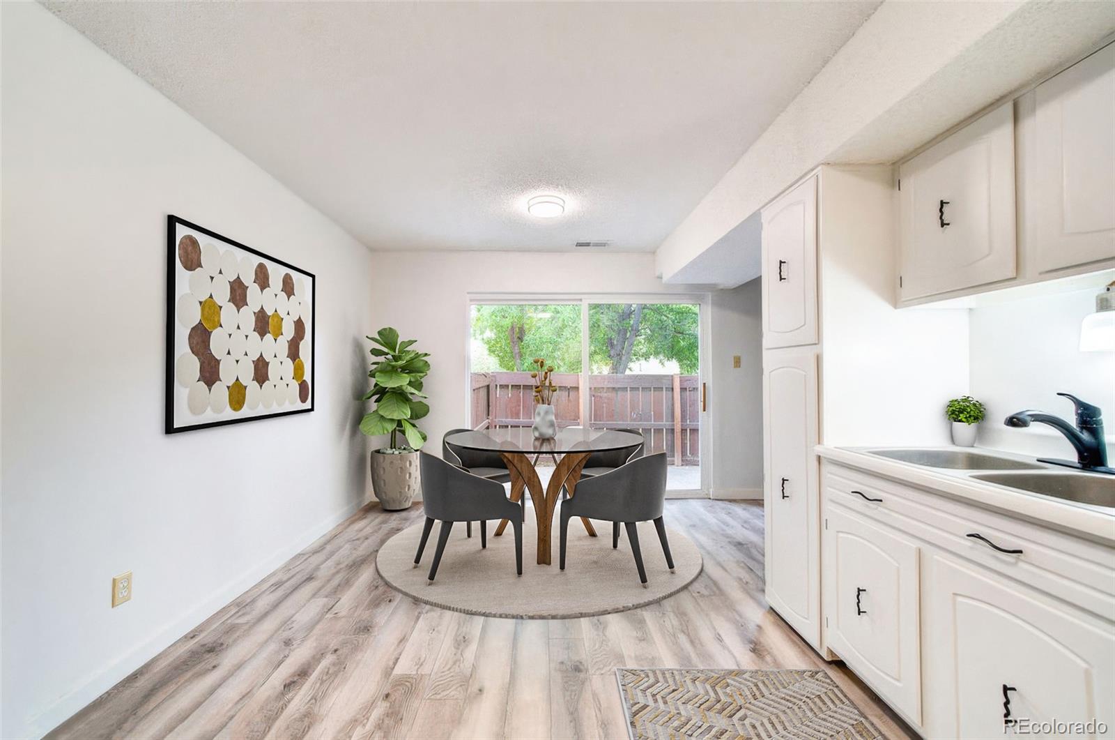 112 Scotland Road, Unit F Pueblo, CO 81001 - Photo 3 of 39 a dining room with furniture and window
