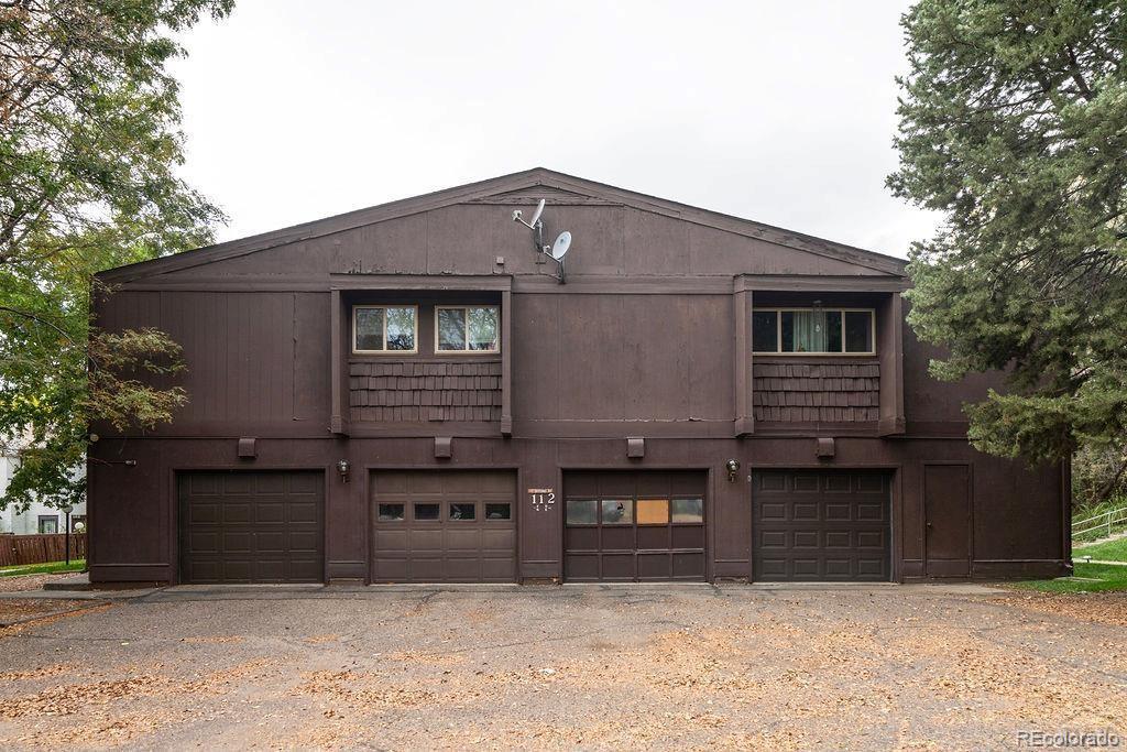 112 Scotland Road, Unit F Pueblo, CO 81001 - Photo 38 of 39 a front view of a house with yard