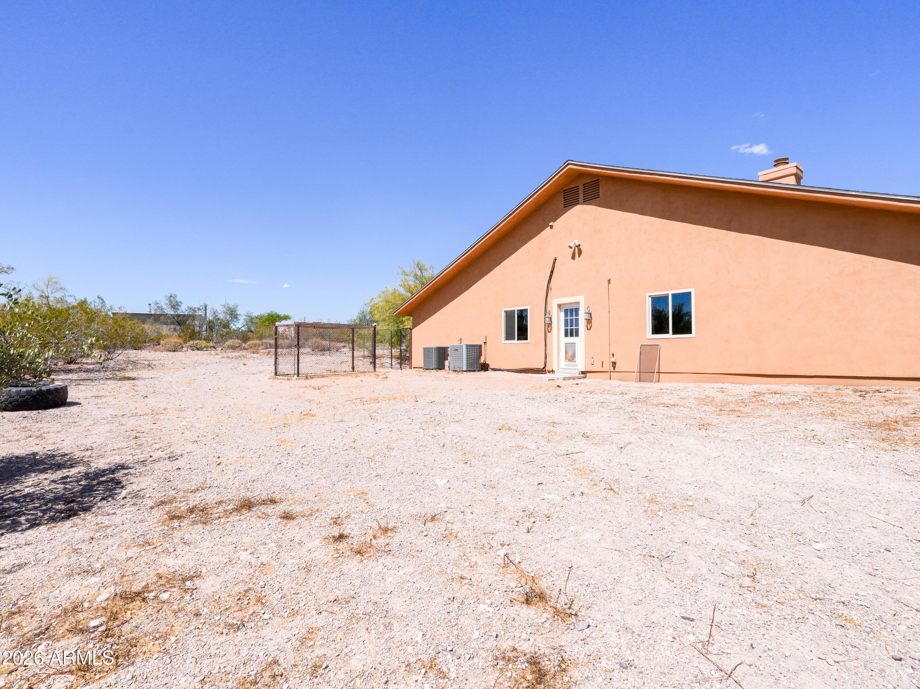 1224 North Acacia Road Apache Junction, AZ 85119 - Photo 40 of 48 a view of white house with a yard