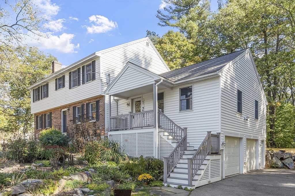 120 Concord Road Billerica, MA 01821 - Photo 1 of 42 a front view of a house with a garden