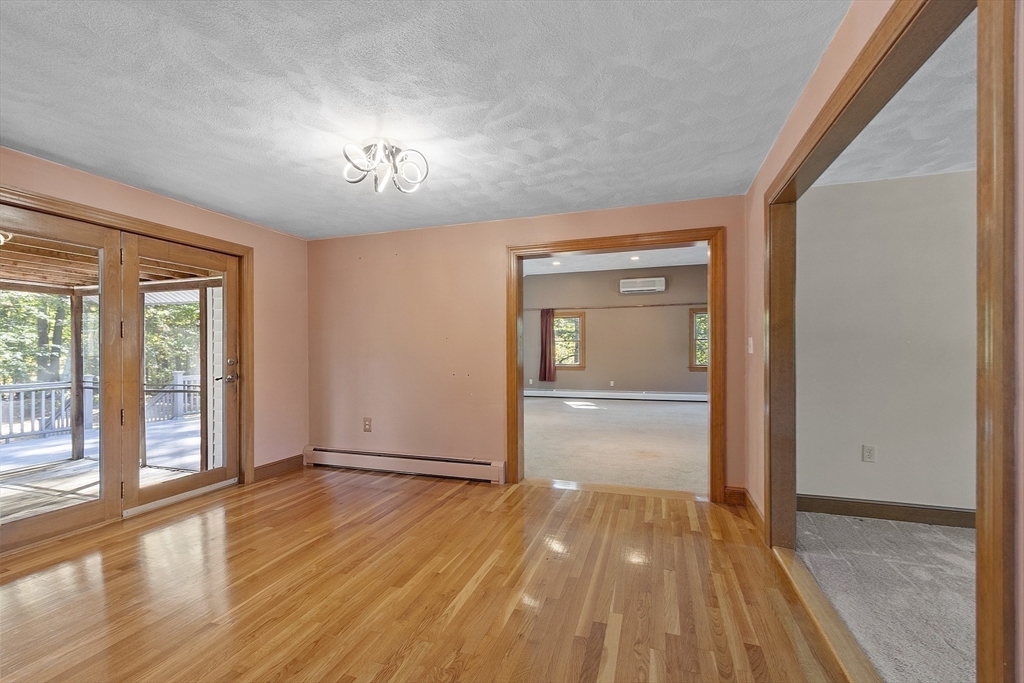 120 Concord Road Billerica, MA 01821 - Photo 18 of 42 wooden floor in an empty room with a window