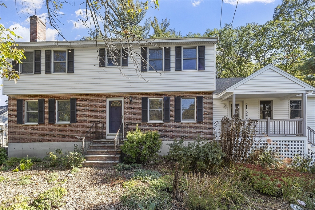 120 Concord Road Billerica, MA 01821 - Photo 2 of 42 a front view of a house with garden