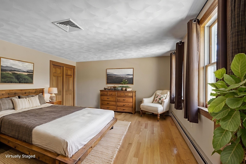 120 Concord Road Billerica, MA 01821 - Photo 25 of 42 a spacious bedroom with a bed and a couch