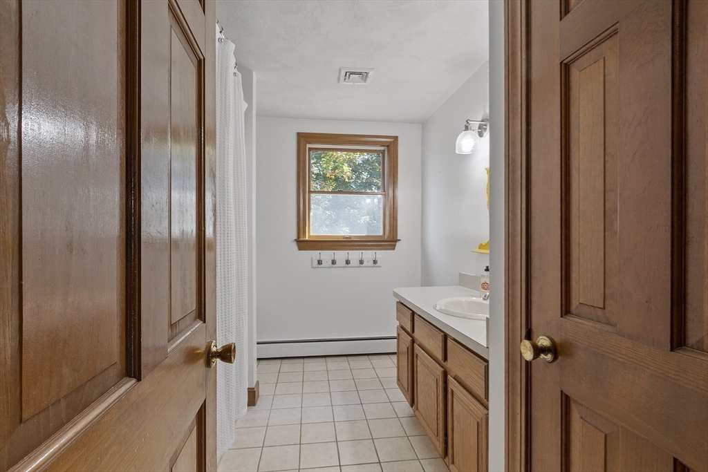 120 Concord Road Billerica, MA 01821 - Photo 34 of 42 a bathroom with a sink a toilet and shower