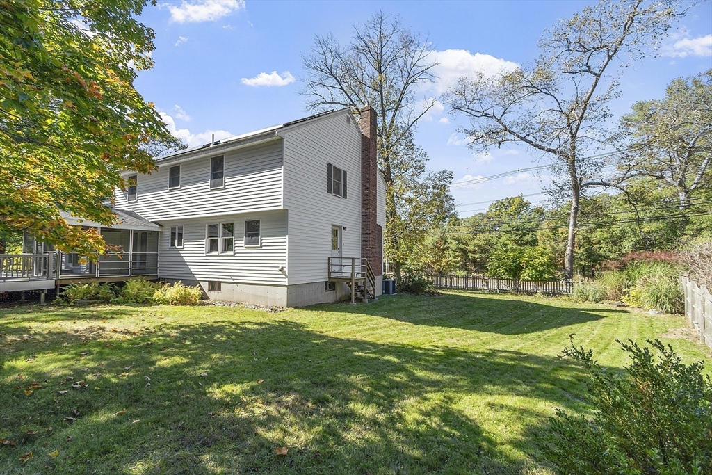 120 Concord Road Billerica, MA 01821 - Photo 6 of 42 a backyard of a house with table and chairs