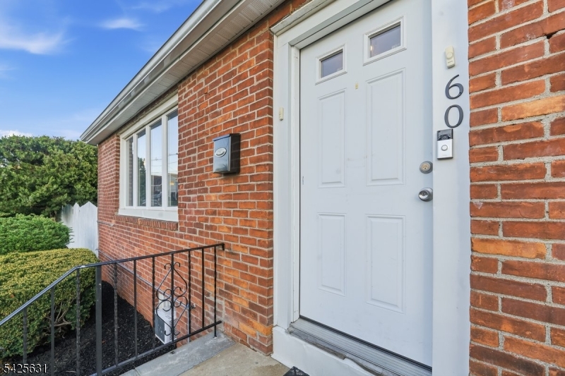 60 Westervelt Place Lodi, NJ 07644 - Photo 6 of 48 a view of a brick house with a door