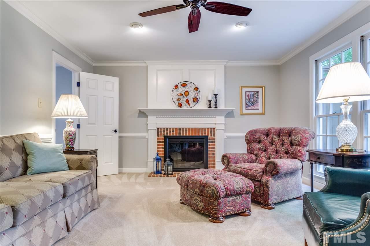 2020 Torrington Street Raleigh, NC 27615 - Photo 11 of 25 a living room with furniture and a fireplace