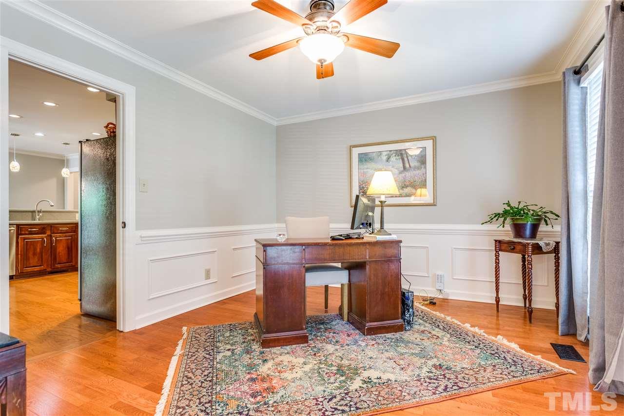 2020 Torrington Street Raleigh, NC 27615 - Photo 12 of 25 a work room with furniture and wooden floor