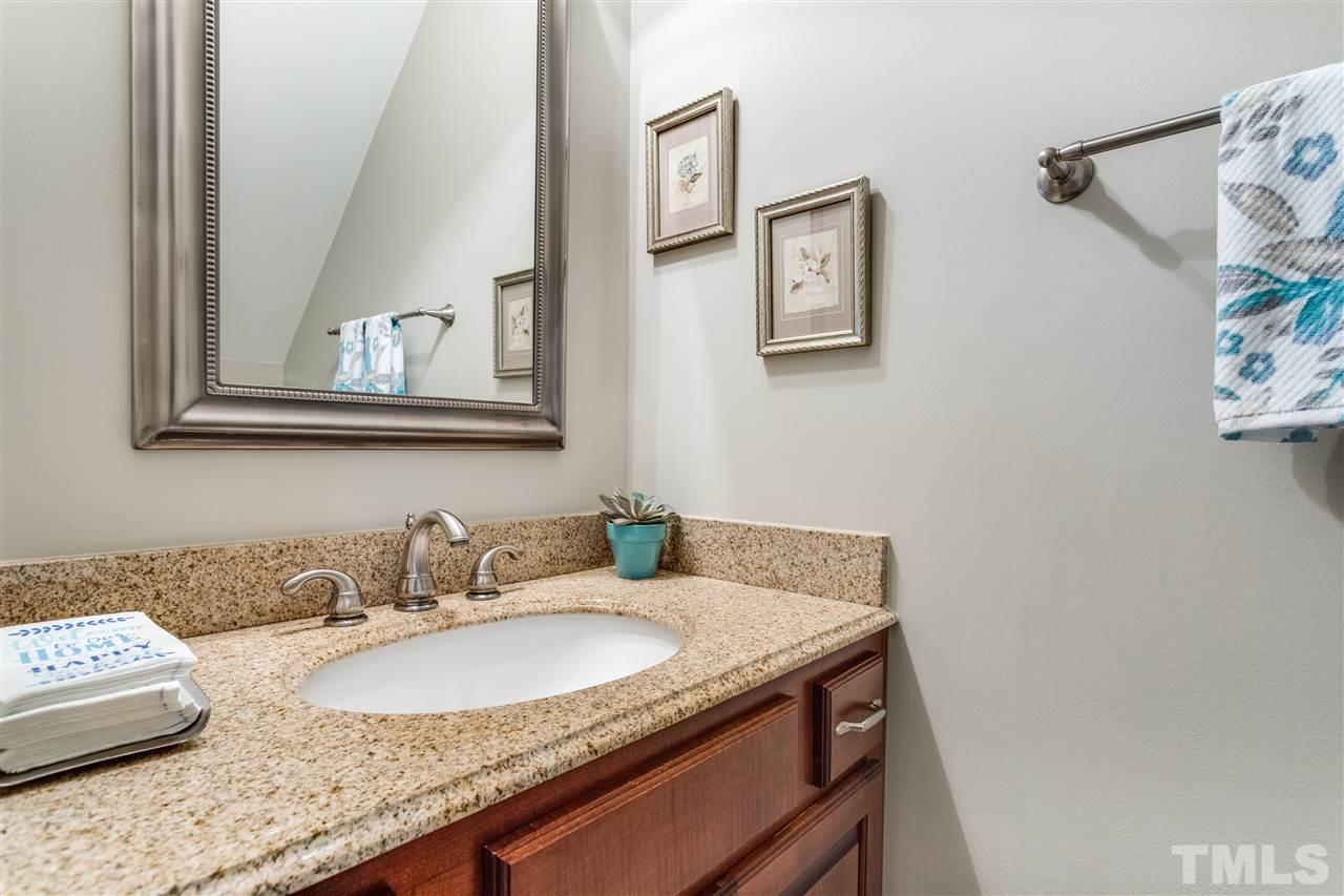 2020 Torrington Street Raleigh, NC 27615 - Photo 13 of 25 a bathroom with a granite countertop sink and a mirror