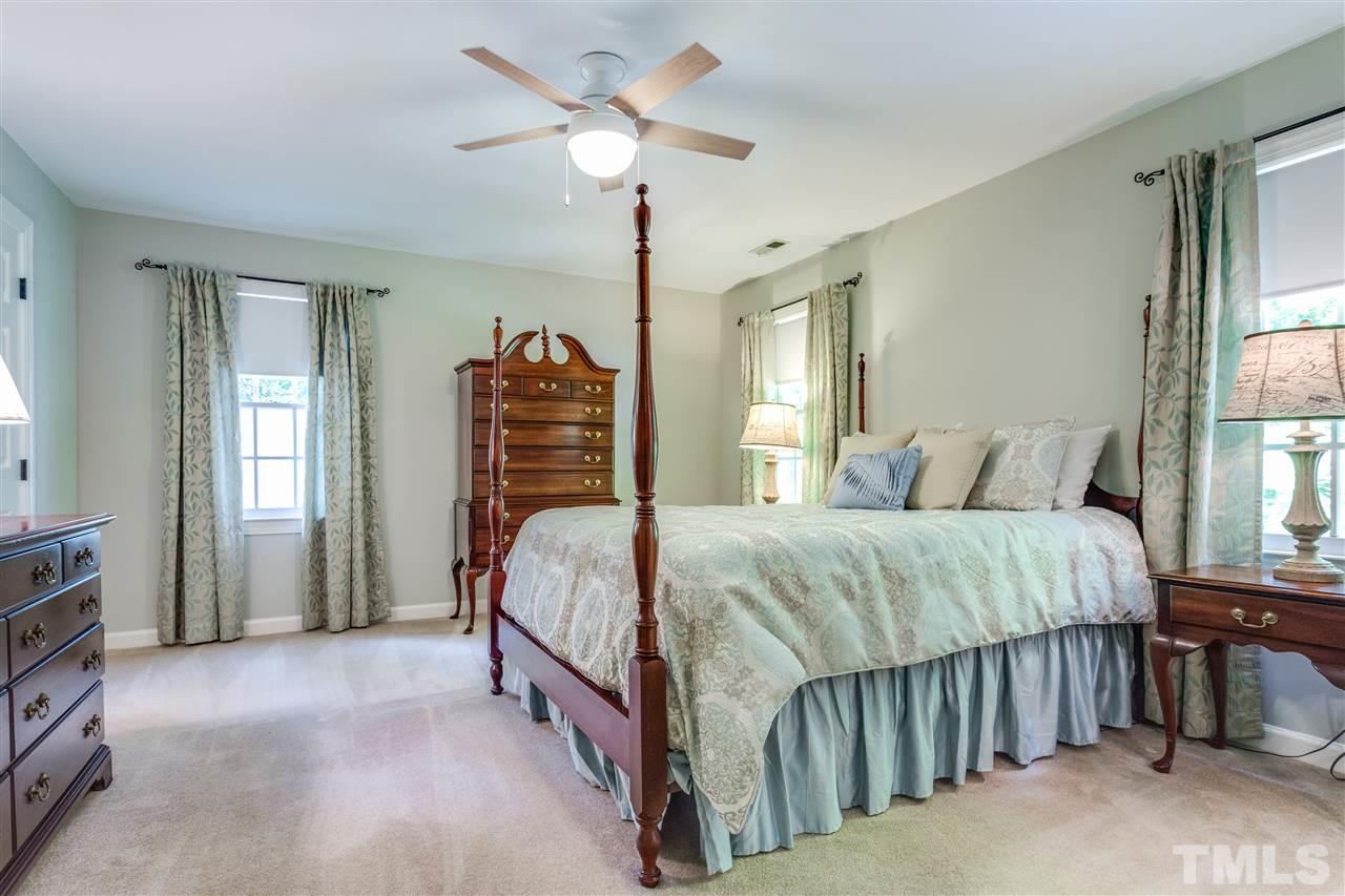 2020 Torrington Street Raleigh, NC 27615 - Photo 16 of 25 a bed sitting in a bedroom next to a window