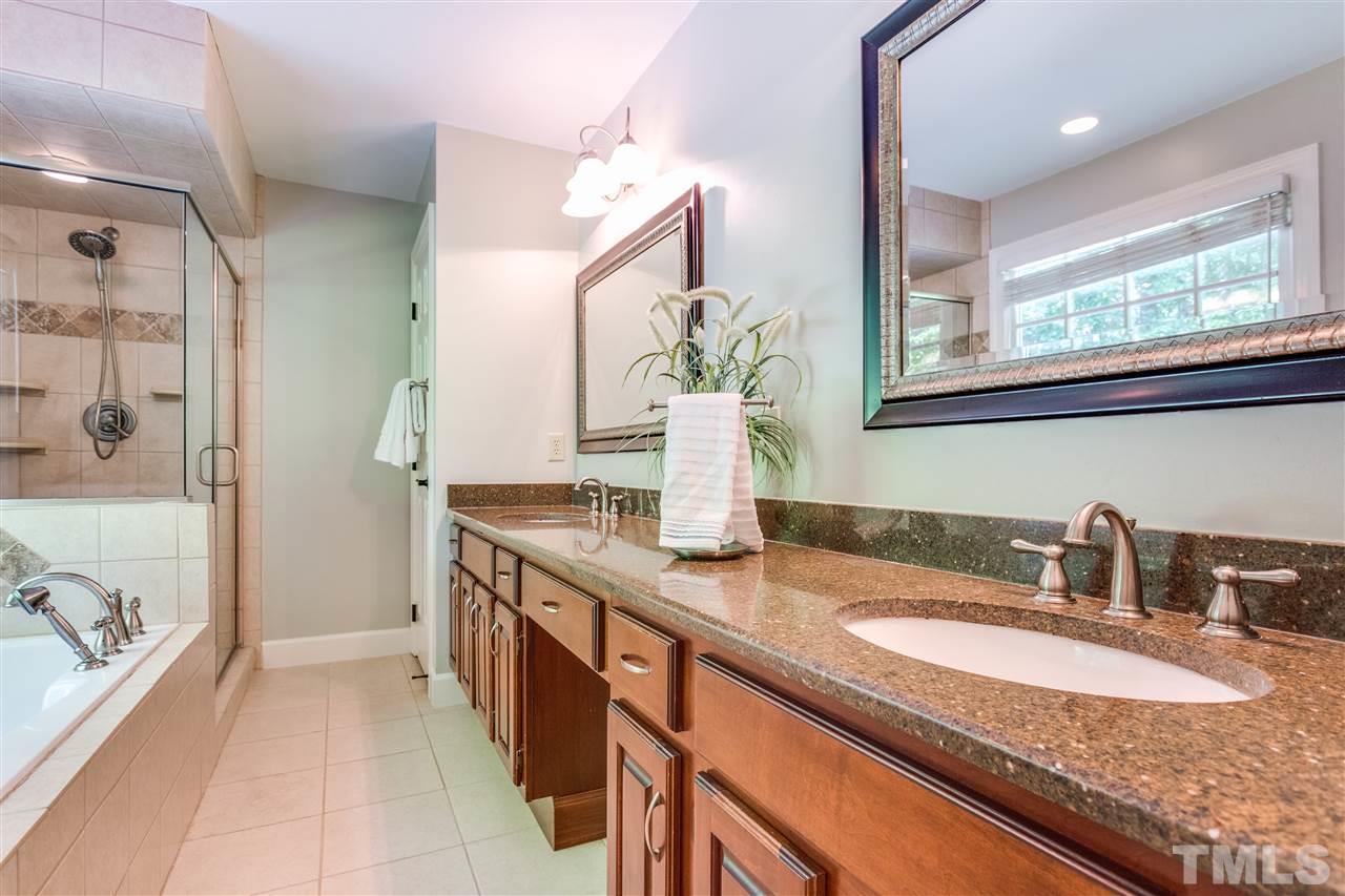 2020 Torrington Street Raleigh, NC 27615 - Photo 17 of 25 a bathroom with a granite countertop sink and a mirror
