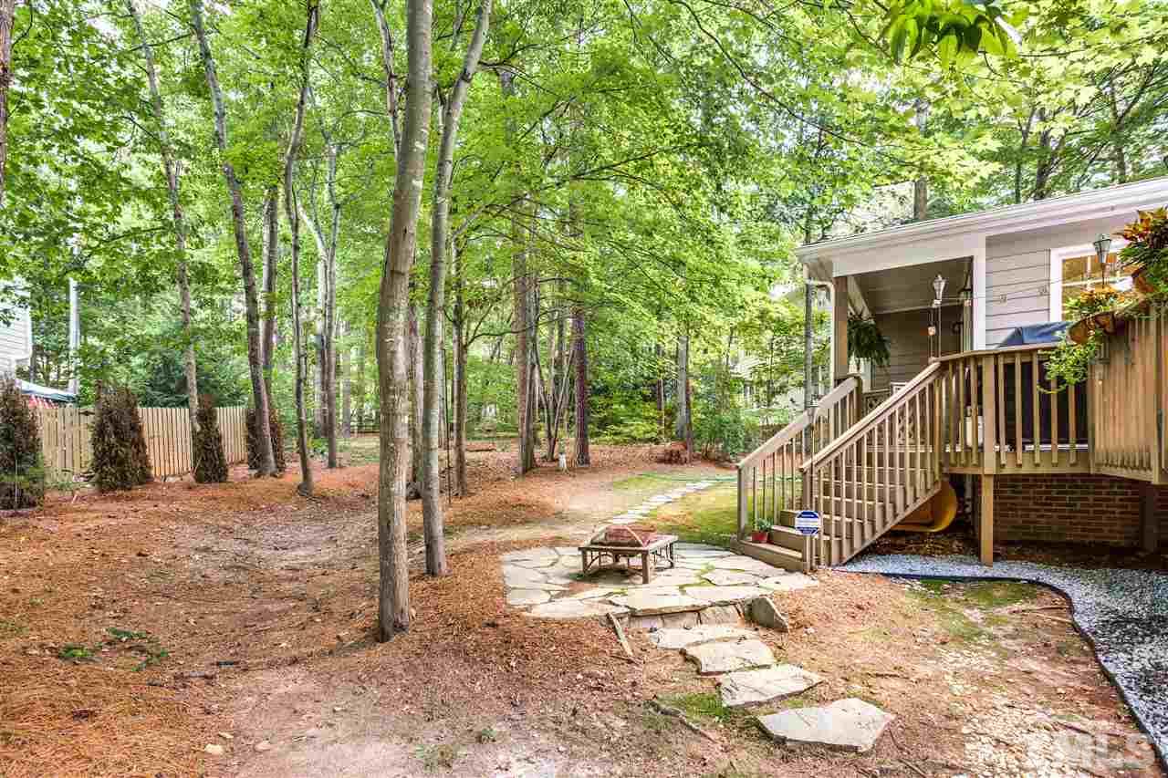 2020 Torrington Street Raleigh, NC 27615 - Photo 24 of 25 a view of a house with backyard and trees