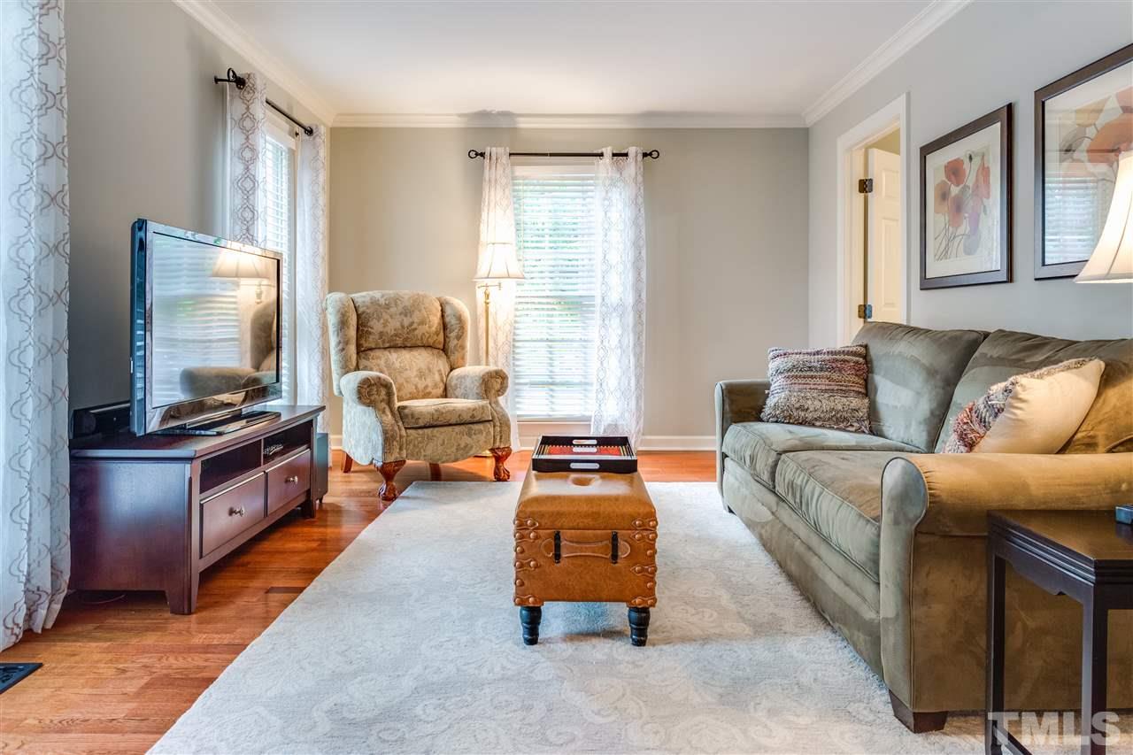 2020 Torrington Street Raleigh, NC 27615 - Photo 5 of 25 a living room with furniture and a flat screen tv