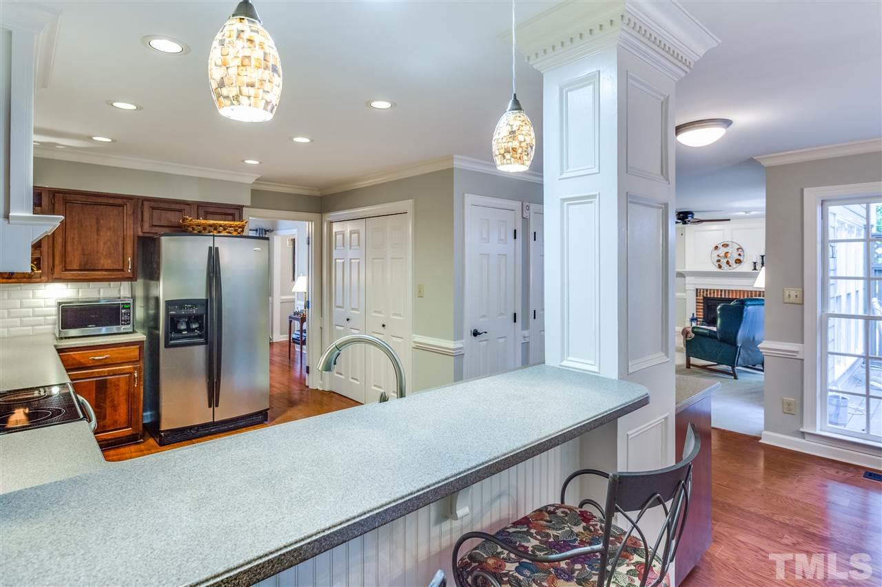 2020 Torrington Street Raleigh, NC 27615 - Photo 9 of 25 a kitchen with stainless steel appliances granite countertop a refrigerator and a sink