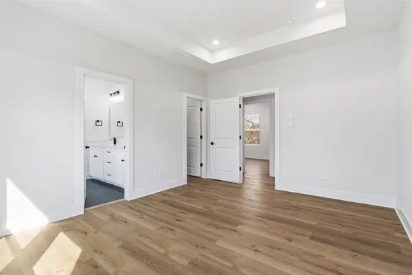 a white room with wooden floor