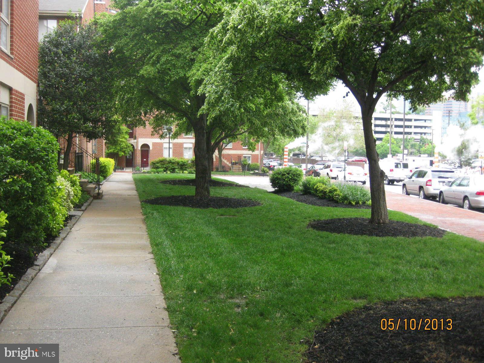 512 Charles Street, Unit R90 Baltimore, MD 21201 - Photo 2 of 10 a view of a park with large trees