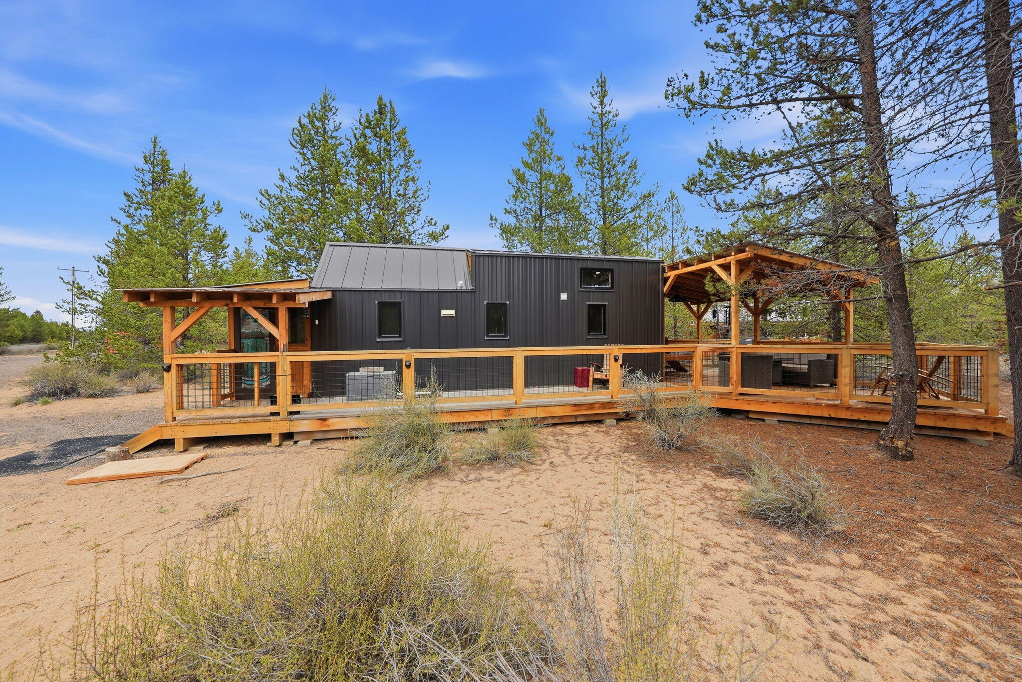 54270 Huntington Road La Pine, OR 97739 - Photo 37 of 68 a view of a house with backyard and sitting area