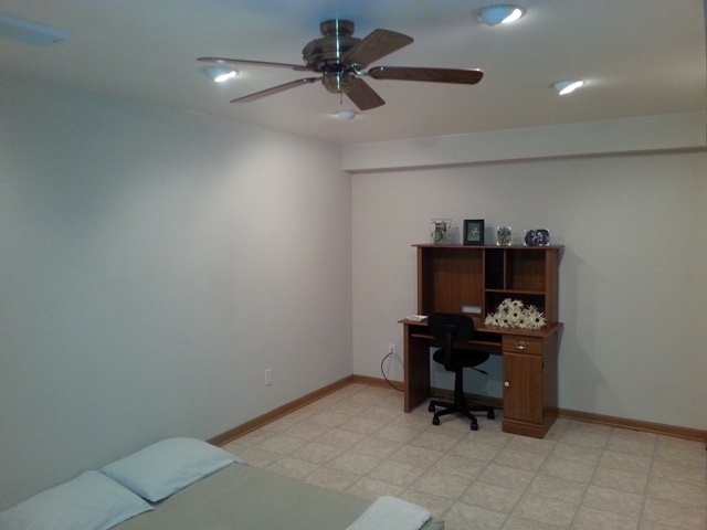 220 Willis Avenue Rochelle, IL 61068 - Photo 15 of 25 a room with a desk and a chandelier