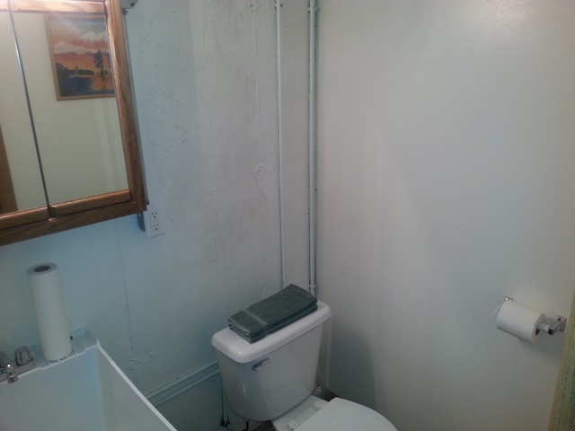 220 Willis Avenue Rochelle, IL 61068 - Photo 16 of 25 a white toilet sitting next to a shower