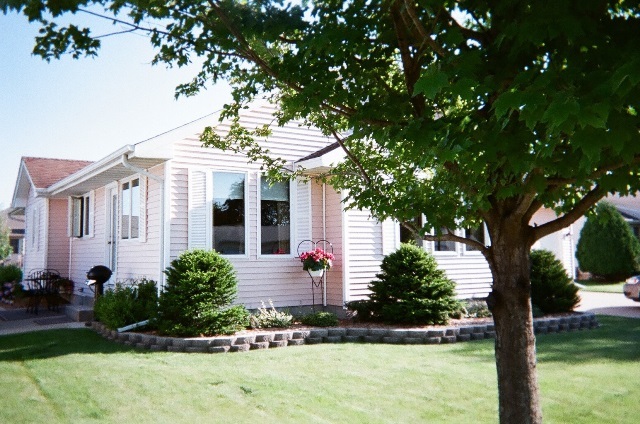 220 Willis Avenue Rochelle, IL 61068 - Photo 20 of 25 a front view of a house with garden