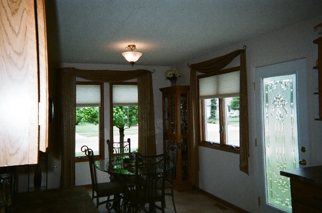 220 Willis Avenue Rochelle, IL 61068 - Photo 5 of 25 a view of a hallway with wooden floor and furniture