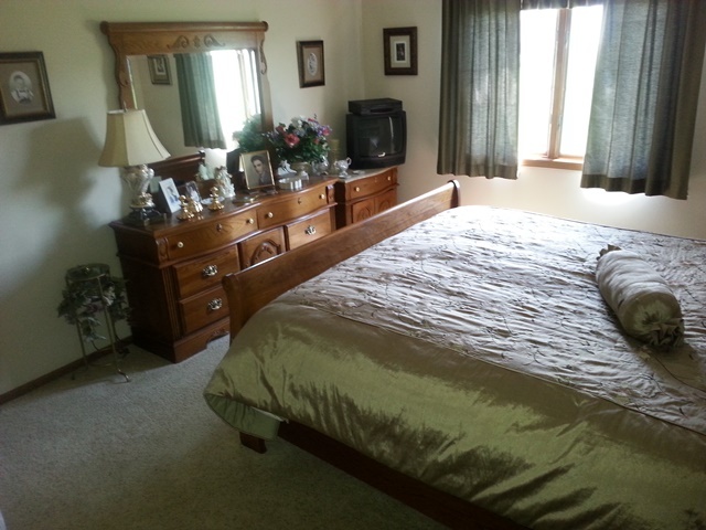 220 Willis Avenue Rochelle, IL 61068 - Photo 7 of 25 a bedroom with a bed dresser mirror and window