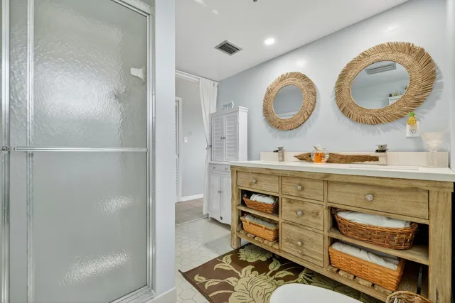 a bathroom with a mirror and a sink