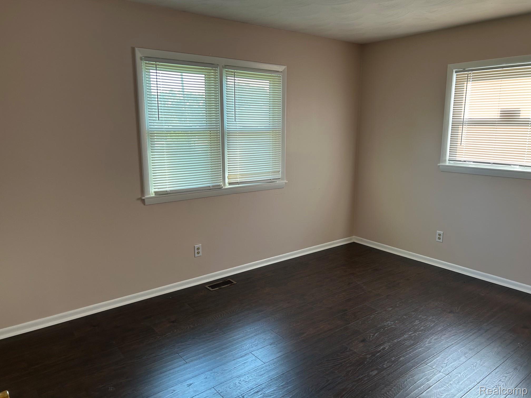 8233 West Iosco Road Fowlerville, MI 48836 - Photo 7 of 7 Rich wood-finish flooring complemented by neutral wall tones