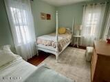 73 Stockton Avenue Ocean Grove, NJ 07756 - Photo 17 of 24 a bedroom with a bed and a window