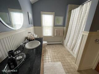 73 Stockton Avenue Ocean Grove, NJ 07756 - Photo 20 of 24 a bathroom with a sink a toilet and a mirror