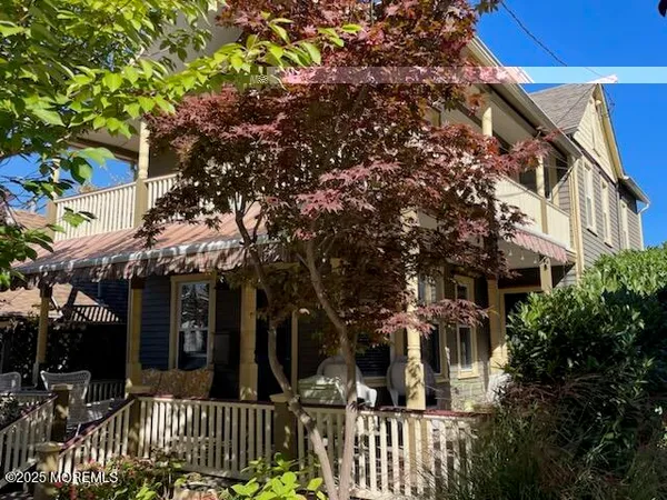 front view of house with a tree