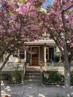 73 Stockton Avenue Ocean Grove, NJ 07756 - Photo 3 of 24 a front view of a house with a yard