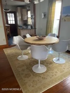 a dining room with table and chairs