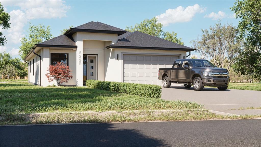 6220 Palm River Road Tampa, FL 33619 - Photo 2 of 10 a front view of a house with garden