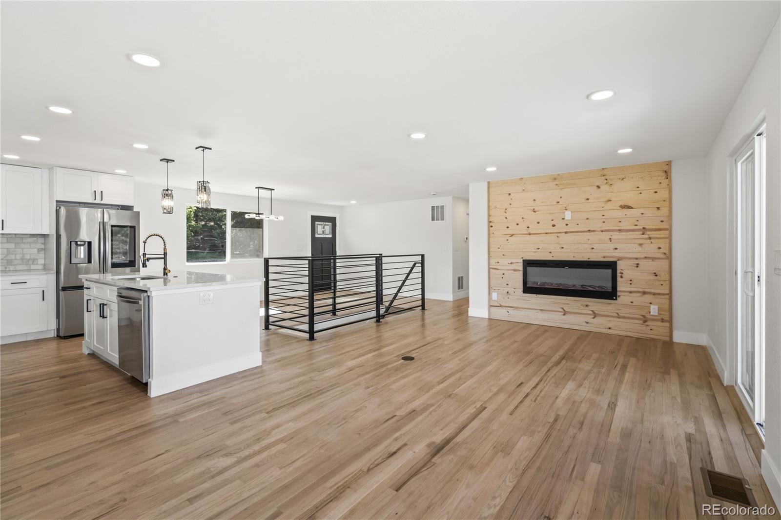 3495 Miller Street Wheat Ridge, CO 80033 - Photo 14 of 40 a view of kitchen with furniture and wooden floor