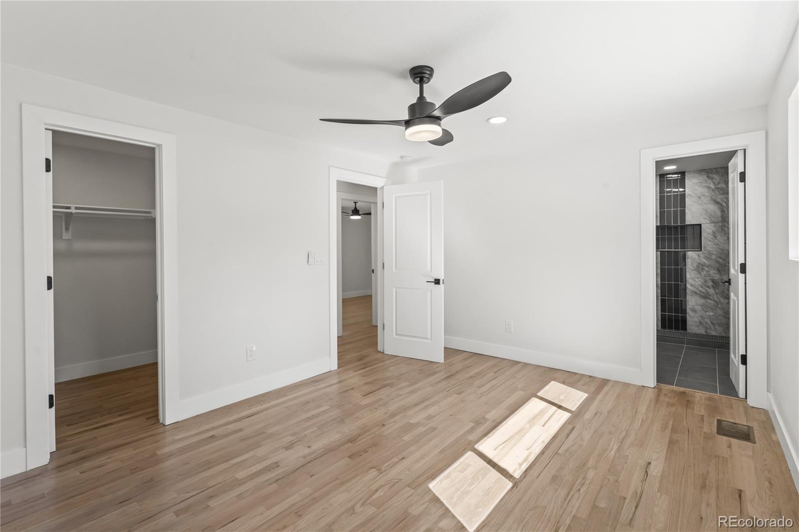 3495 Miller Street Wheat Ridge, CO 80033 - Photo 20 of 40 a view of empty room with wooden floor