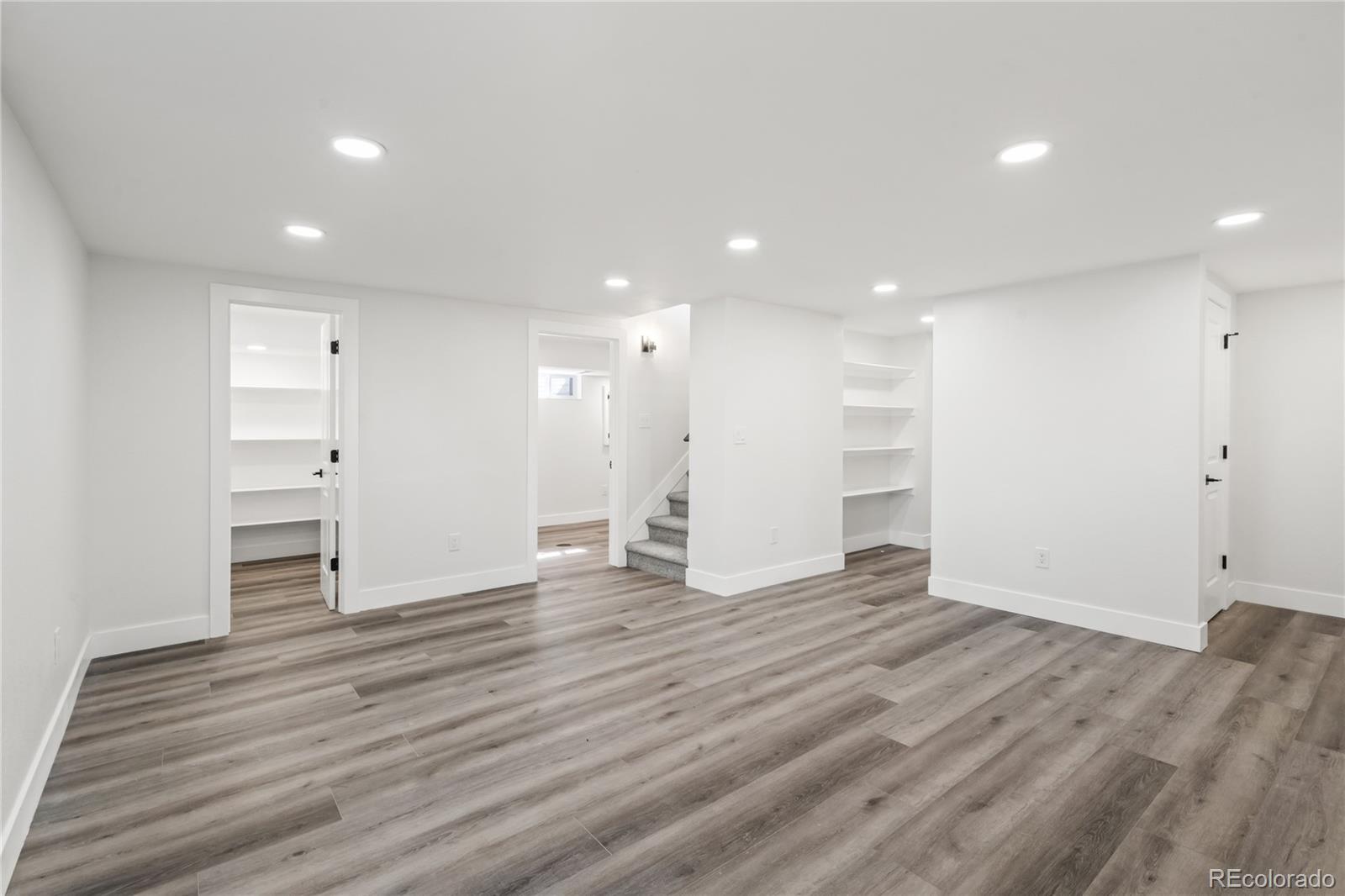 3495 Miller Street Wheat Ridge, CO 80033 - Photo 23 of 40 a view of an empty room with wooden floor