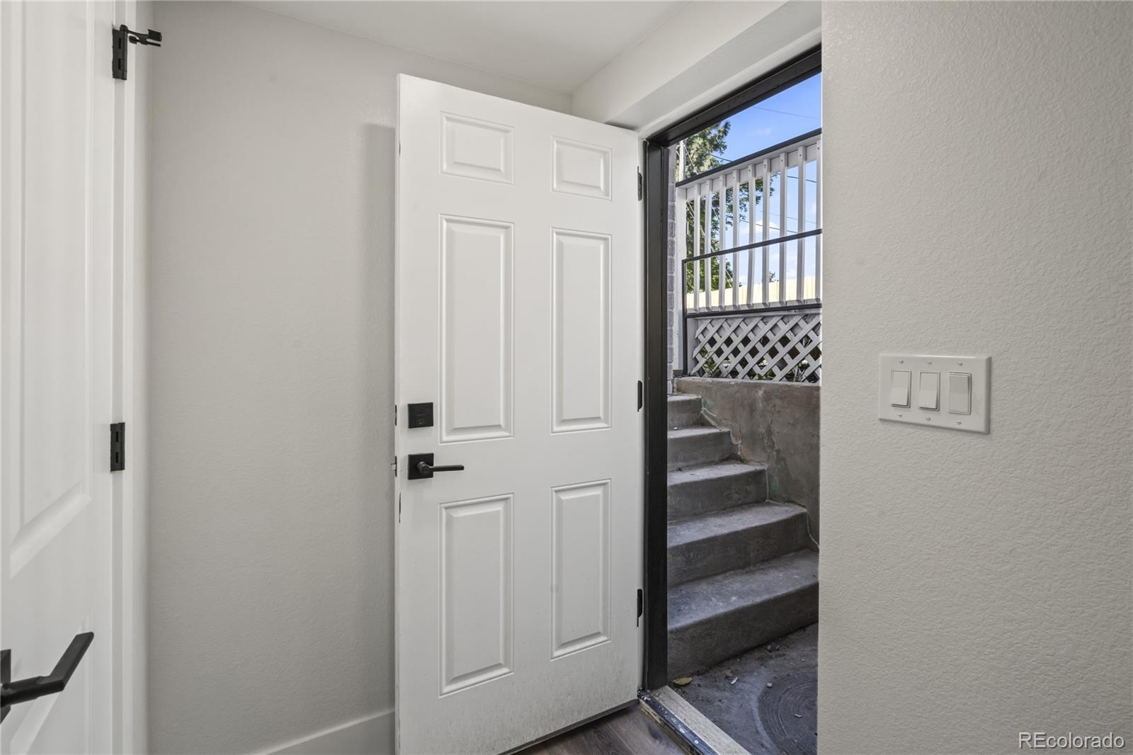 3495 Miller Street Wheat Ridge, CO 80033 - Photo 25 of 40 a view of front door with wooden floor