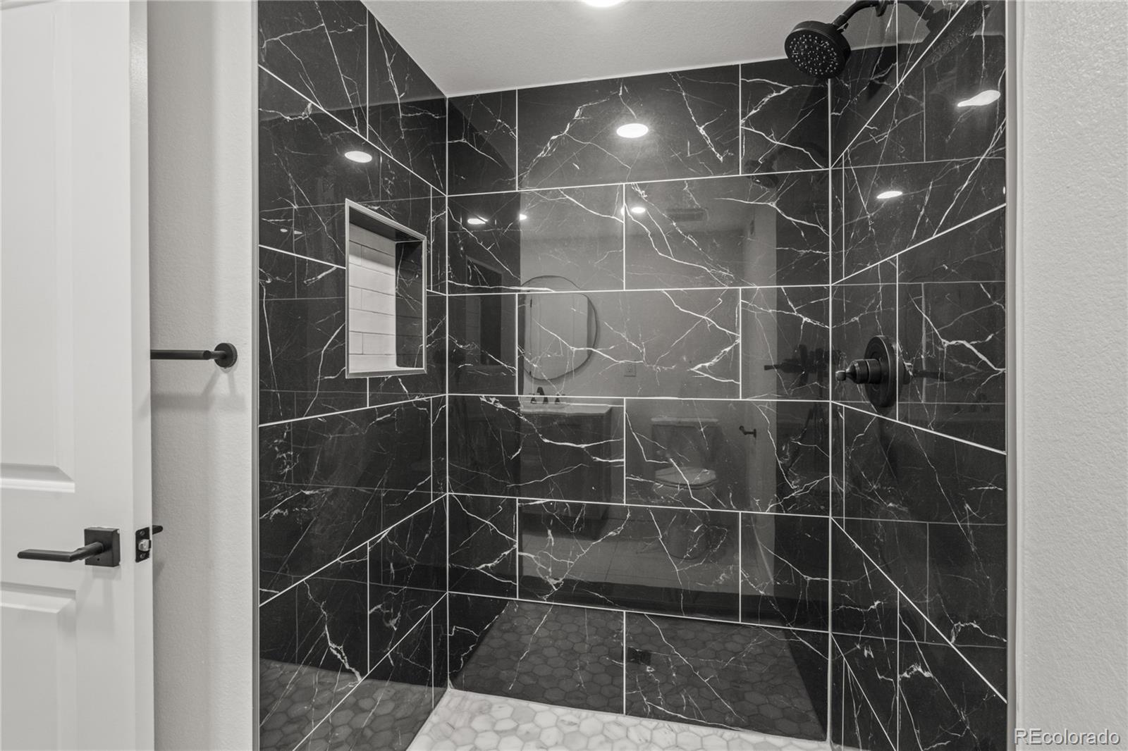 3495 Miller Street Wheat Ridge, CO 80033 - Photo 27 of 40 a bathroom with a shower