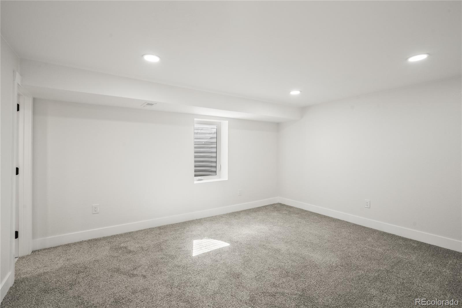 3495 Miller Street Wheat Ridge, CO 80033 - Photo 37 of 40 an empty room with a empty space and a window