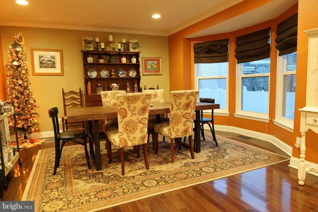 a view of a dining room with furniture and a rug