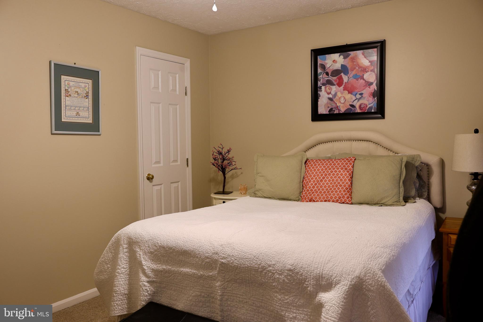 112 Preakness Drive Mount Laurel, NJ 08054 - Photo 21 of 32 a bedroom with a bed and painting on the wall