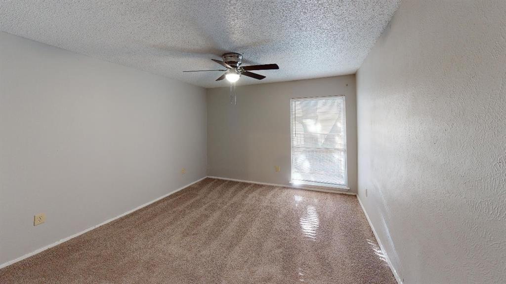9696 Walnut Street, Unit 1006 Dallas, TX 75243 - Photo 4 of 6 wooden floor in an empty room with a window