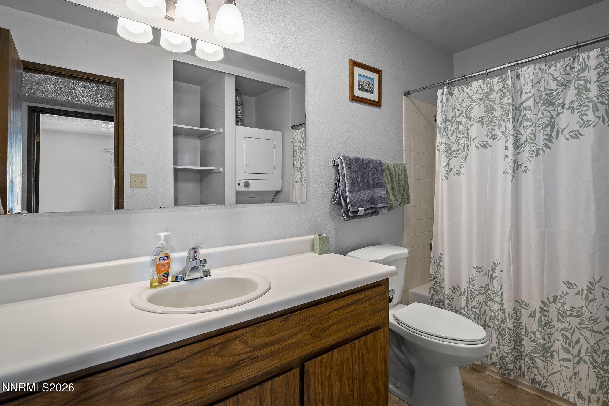 400 South Saliman Road, Unit 129 Carson City, NV 89701 - Photo 10 of 15 a bathroom with a sink a toilet and mirror